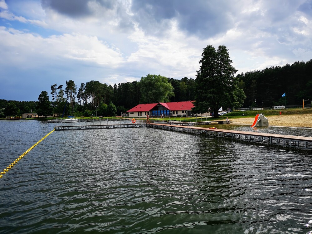 Small travel bag, bicycle or quiet lakeside landscape.